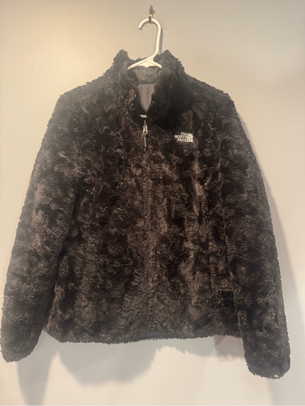 * Woman’s North Face Fleece Reversible Black Jacket.